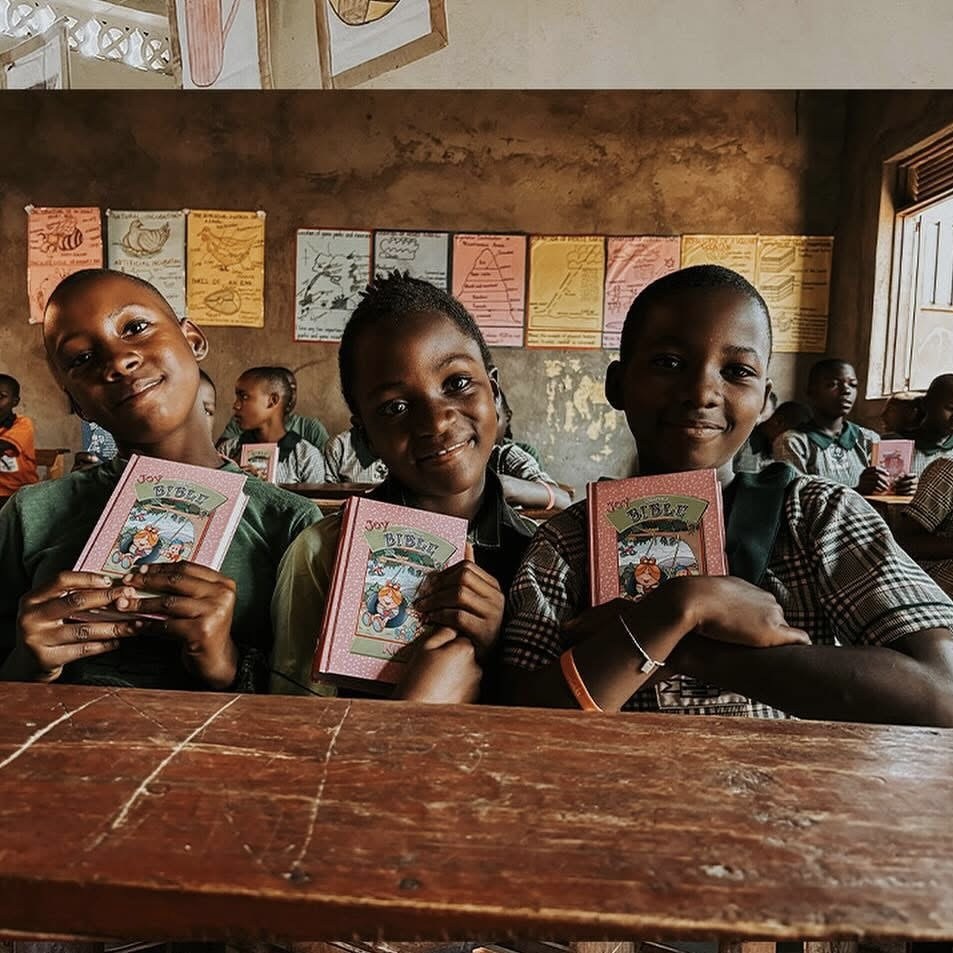 Children smiling and holding their Bibles